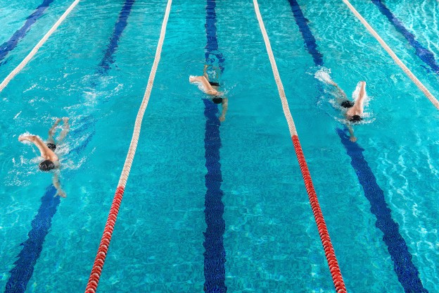 three-male-swimmers-racing-against-each-other (1).jpg